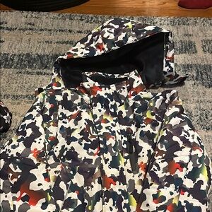 Vibrant Red and Orange Puffer Jackets with Modern Design